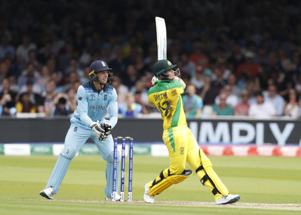 Australia's Steve Smith hits runs off the bowling of England's Adil Rashid during their Cricket World Cup match between England and Australia at Lord's cricket ground in London, Tuesday, June 25, 2019. (AP Photo/Alastair Grant)