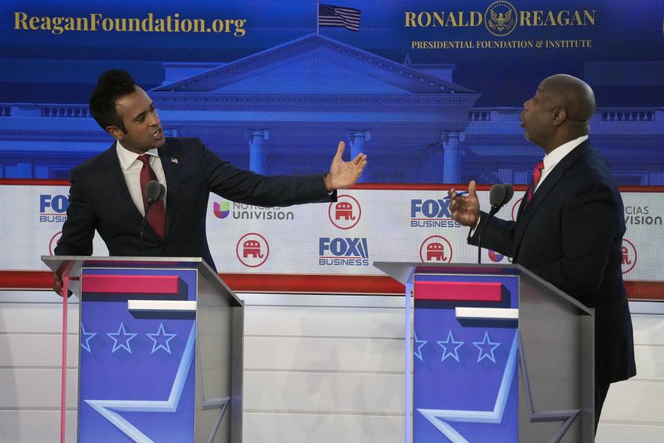 Businessman Vivek Ramaswamy, left, argues a point with Sen. Tim Scott, R-S.C.,during a Republican presidential primary debate hosted by FOX Business Network and Univision, Wednesday, Sept. 27, 2023, at the Ronald Reagan Presidential Library in Simi Valley, Calif. | Mark J. Terrill, Associated Press