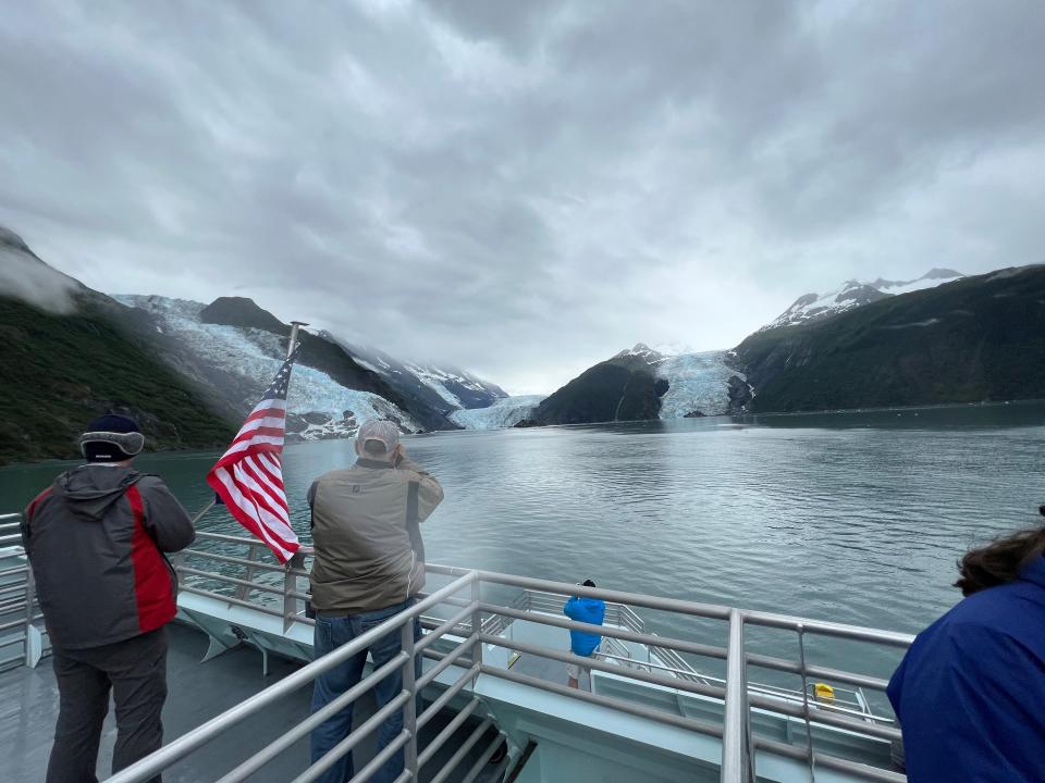 observation deck with people on it looking at glaciers