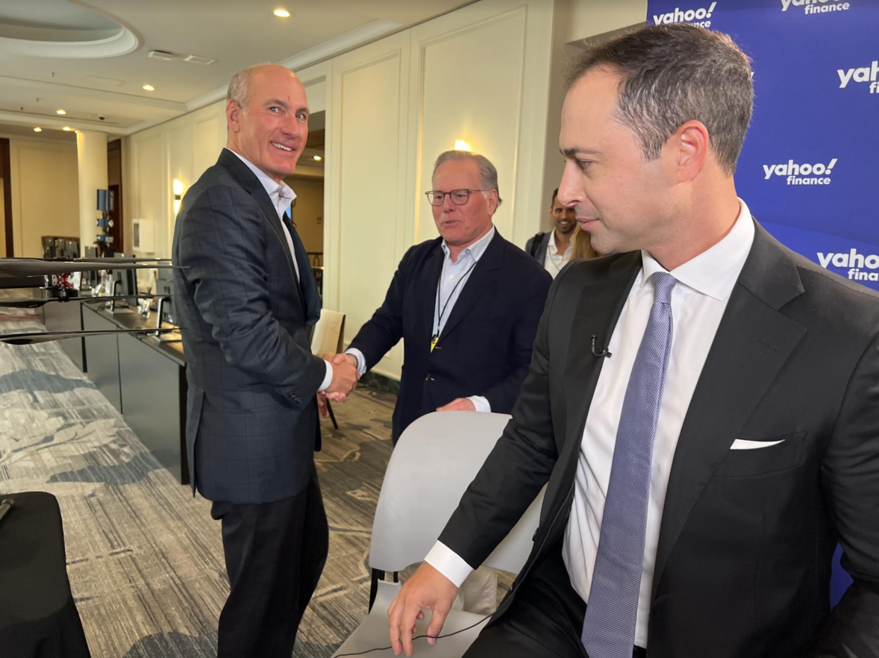 Friends reunite at the Goldman Sachs tech conference. AT&T CEO John Stankey (left) reunites with Warner Bros. CEO David Zaslav (right). Stankey sold WarnerMedia to Zaslav in 2022.