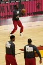 Detroit Pistons players wear warm up t-shirts commemorating the Martin Luther King Jr. holiday before an NBA basketball game against the Miami Heat, Monday, Jan. 18, 2021, in Miami. (AP Photo/Marta Lavandier)