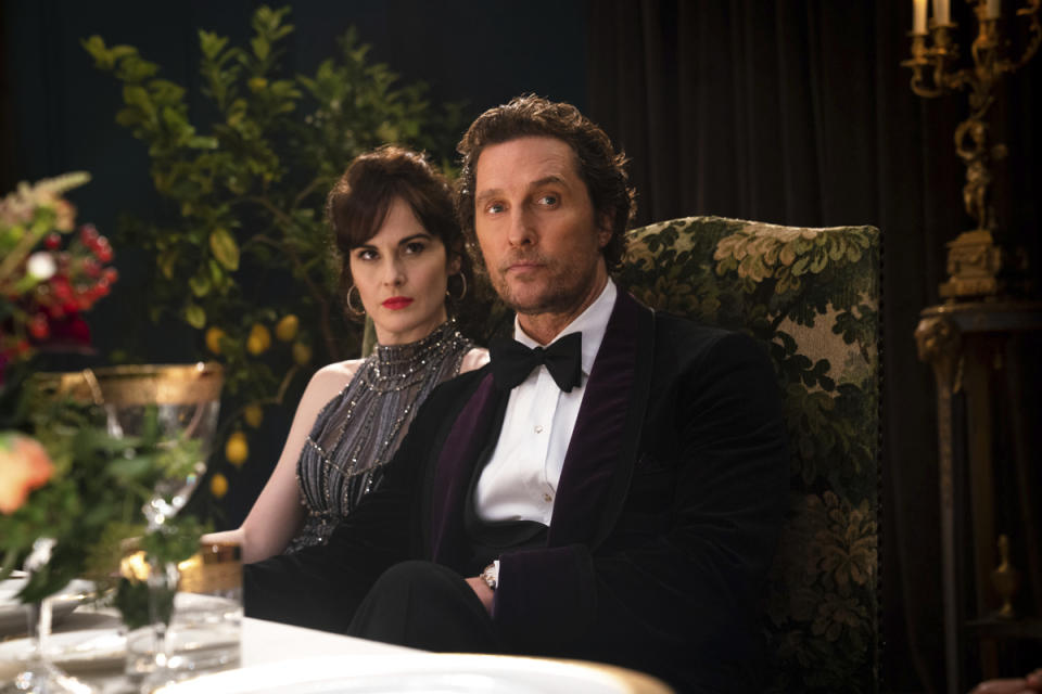 This image released by STXfilms shows Michelle Dockery, left, and Matthew McConaughey in a scene from "The Gentlemen." (Christopher Raphael/STXfilms via AP)