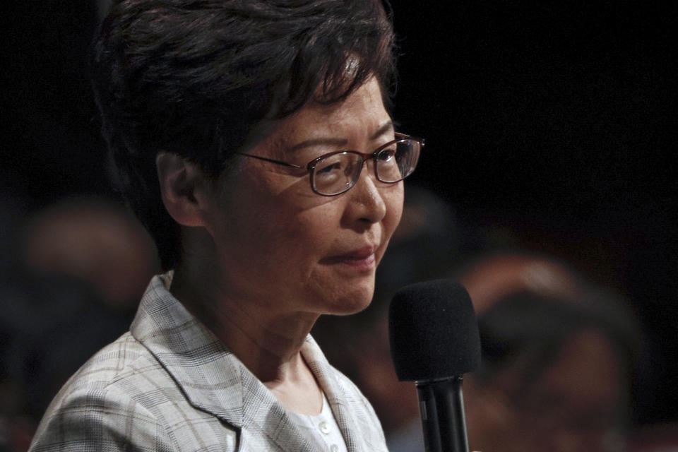 Hong Kong Chief Executive Carrie Lam speaks during a community dialogue with selected participants at the Queen Elizabeth Stadium in Hong Kong, Thursday, Sept. 26, 2019. Scores of protesters chanted slogans outside a stadium in downtown Hong Kong as embattled city leader Carrie Lam began a town hall session Thursday aimed at cooling down months of demonstrations for greater democracy in the semi-autonomous Chinese territory. (AP Photo/Kin Cheung)