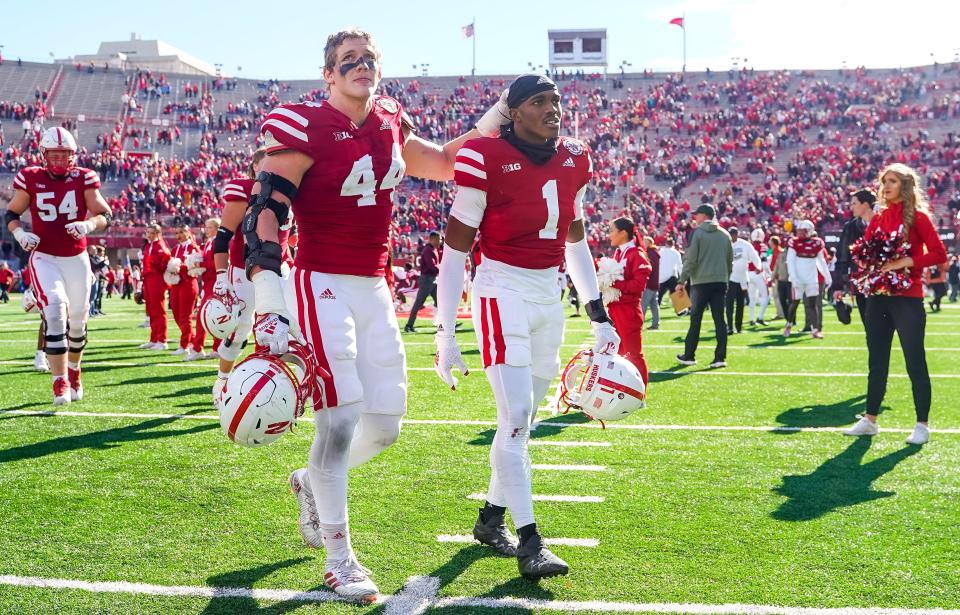 Nov 5, 2022; Lincoln, Nebraska, USA; Nebraska Cornhuskers defensive end Garrett Nelson (44) and defensive back Marques Buford Jr. (1) walk off the field after the 20-13 loss to the Minnesota Golden Gophers at Memorial Stadium. Mandatory Credit: Dylan Widger-USA TODAY Sports