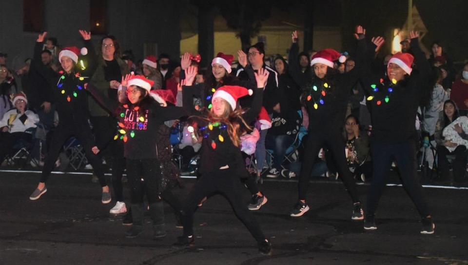 A local youth dance team performs during the Annual Los Banos Christmas Parade on Friday, Dec. 3, 2021 in Los Banos, Calif.