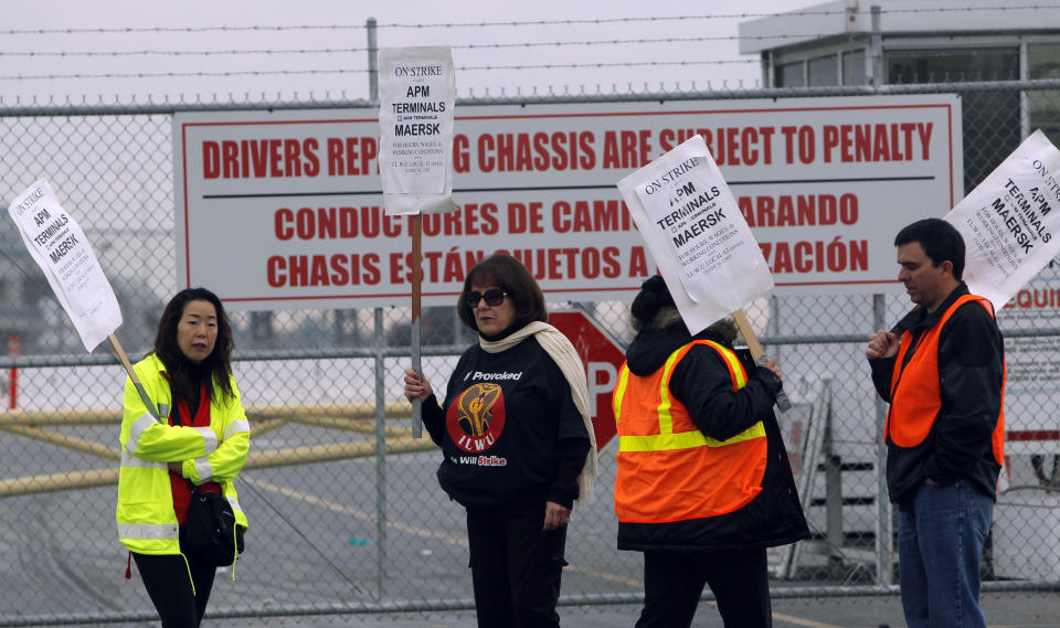 Striking protestors are shown at the Port of Los Angeles Wednesday Nov. 28, 2012 in Los Angeles. Striking workers shut down the largest terminal at the Port of Los Angeles for a second day on Wednesday, ignoring an arbitrator's order to return to work and raising the possibility of a larger job action that could paralyze the nation's busiest port complex. (AP Photo/Nick Ut)