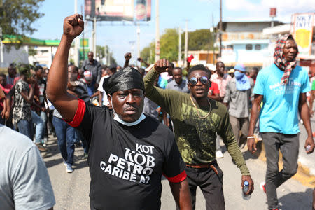 Demonstrators take part in a protest against former government officials accused of misusing Petrocaribe funds and the country's inflation rate in Port-au-Prince, Haiti February 7, 2019. REUTERS/Jeanty Junior Augustin