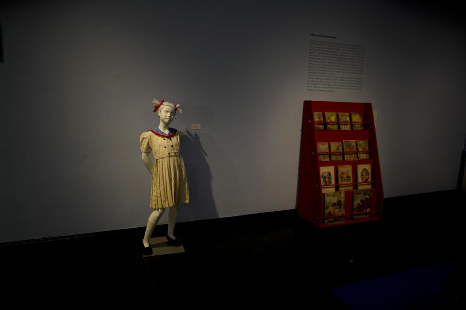 A dress of the "Childhood and Peronism, the toys of the Eva Perón Foundation" exhibit is displayed at the Evita Museum in Buenos Aires, Argentina Wednesday, April 17, 2019. To mark the 100th anniversary of the birth of Argentina's so-called "champion of the poor" on May 7, 1919, the Evita Museum in Buenos Aires has inaugurated the exhibit, which displays several dozen of toys distributed by the party on Christmas Day and the holiday of Epiphany between 1948 and 1955. (AP Photo/Natacha Pisarenko)