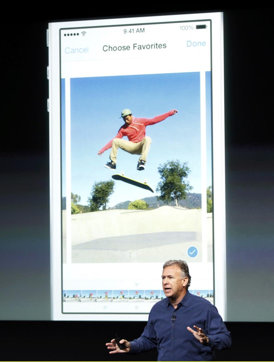 Phil Schiller, senior vice president of worldwide marketing for Apple Inc, talks about the new iPhone 5S camera at Apple Inc's media event in Cupertino