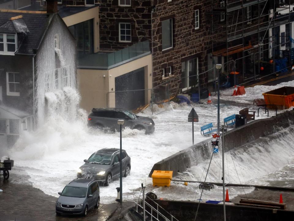 Waves crash over the harbour in Stonehaven (Getty Images)