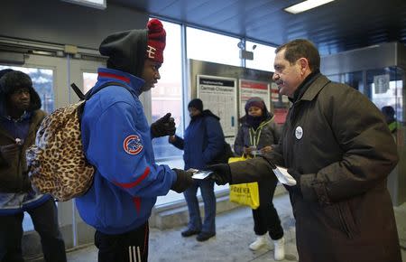 Chicago Mayoral candidate Jesus "Chuy" Garcia greets commuters at a train stop in Chicago, Illinois, January 14, 2015. REUTERS/Jim Young