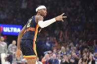 Oklahoma City Thunder guard Shai Gilgeous-Alexander celebrates in the first half of an NBA basketball game against the Memphis Grizzlies, Sunday, March. 10, 2024, in Oklahoma City. (AP Photo/Kyle Phillips)