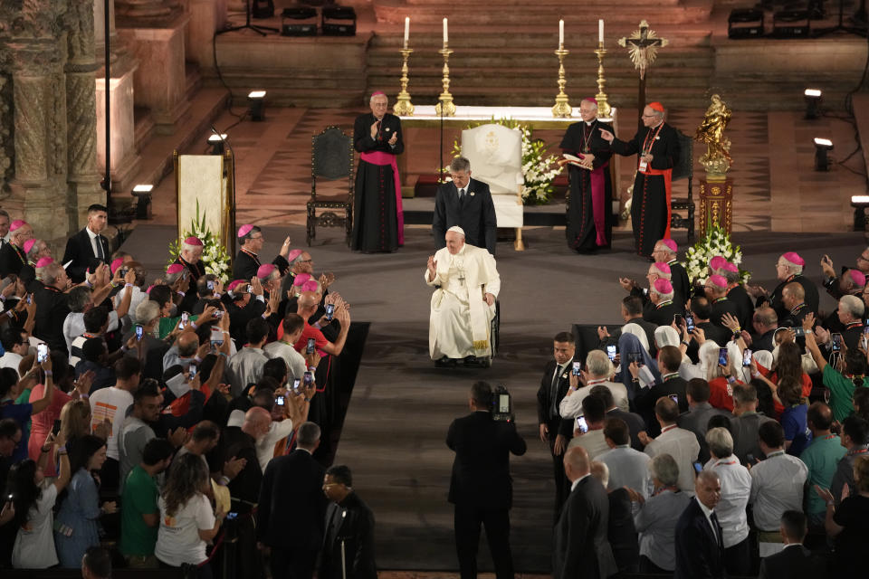 Pope Francis waves as he leaves the Jeronimos Monastery after Vespers in Lisbon, Wednesday, Aug. 2, 2023. Pope Francis has started his five-day pastoral visit to Portugal Wednesday that includes his participation at the 37th World Youth Day, and a pilgrimage to the holy shrine of Fatima. (AP Photo/Armando Franca)