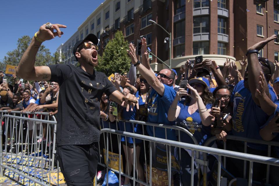 <p>Golden State Warriors guard Stephen Curry (30) walks the street during the Warriors 2017 championship victory parade in downtown Oakland. Mandatory Credit: Kyle Terada-USA TODAY Sports </p>