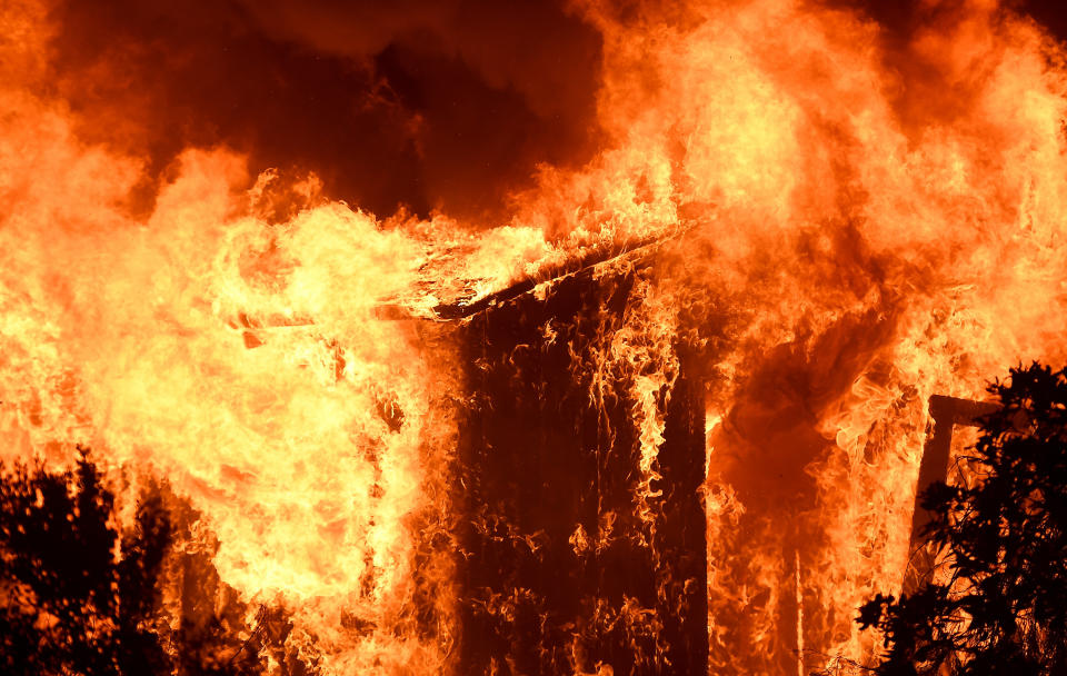 A house burns along&nbsp;the path of the Thomas wildfire in Casita Springs.