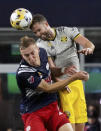 New England Revolution forward Adam Buksa (9) and Columbus Crew defender Josh Williams (3) view for a header during the first half of a MLS soccer match, Saturday, Sept. 18, 2021, in Foxborough, Mass. (AP Photo/Mary Schwalm)