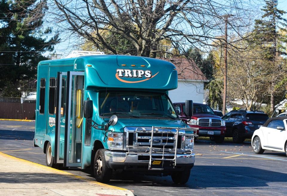 A TRIPS shuttle bus picks up passengers at the Sandusky County Senior Center, one of 17 bus stops around Fremont.