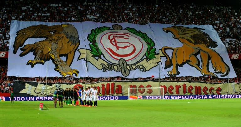 Sevilla supporters display a giant banner before the Spanish league match against Real Betis at the Ramon Sanchez Pizjuan stadium in Sevilla on September 20, 2016