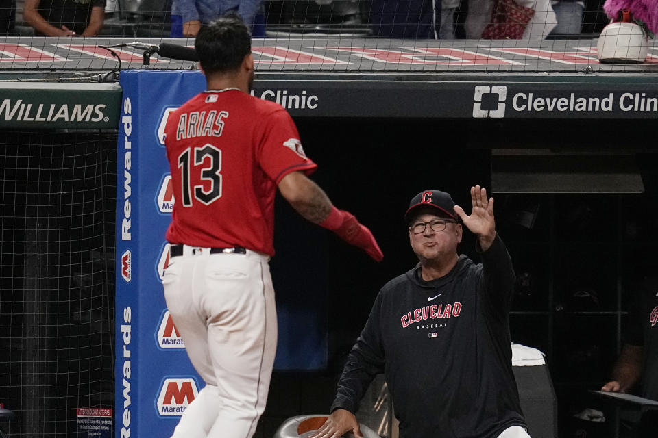 Cleveland Guardians manager Terry Francona, right, greets Gabriel Arias (13), who returns to the dugout after scoring against the Tampa Bay Rays during the seventh inning of a baseball game Friday, Sept. 1, 2023, in Cleveland. (AP Photo/Sue Ogrocki)