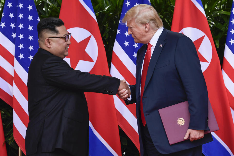 FILE - In this June 12, 2018, file photo, North Korea leader Kim Jong Un, left, and U.S. President Donald Trump shake hands at the conclusion of their meetings at the Capella resort on Sentosa Island in Singapore. To hear a beaming Donald Trump at his June summit with Kim Jong Un in Singapore, the solution to North Korea’s headlong pursuit of nuclear weapons, a foreign policy nightmare that has flummoxed U.S. leaders since the early 1990s, was at hand. (AP Photo/Susan Walsh, Pool, Fie)