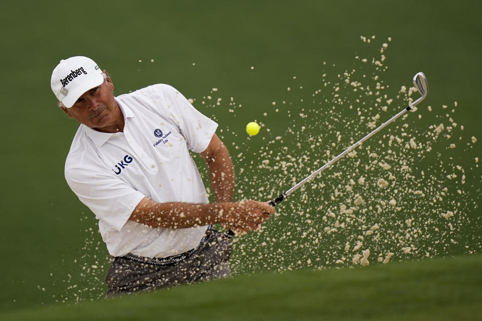 Fred Couples hits out of a bunker on the second hole during the second round of the Masters golf tournament on Friday, April 9, 2021, in Augusta, Ga. (AP Photo/David J. Phillip)