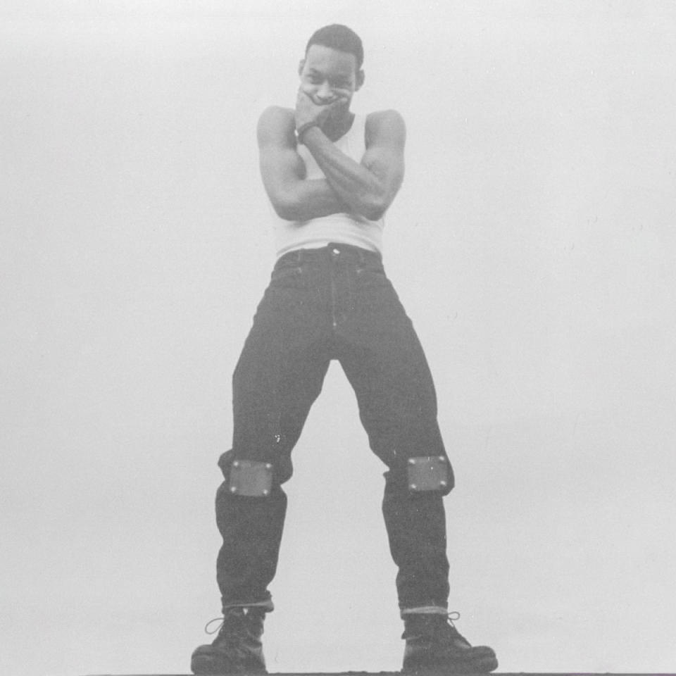 <br>Maurice Malone in his own jeans adorned with metal plates on the knees, 1980s.