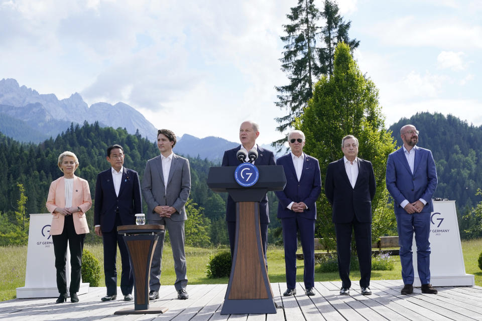 German Chancellor Olaf Scholz speaks and formally launches the global infrastructure partnership on the margins of the G7 Summit in Elmau, Germany, Sunday, June 26, 2022, as from left, Ursula von der Leyen, President of the European Commission, Fumio Kishida, Prime Minister of Japan, Justin Trudeau, Prime Minister of Canada, U.S. President Joe Biden, Mario Draghi, Prime Minister of Italy and Charles Michel, President of the European Council, look on. (AP Photo/Susan Walsh)