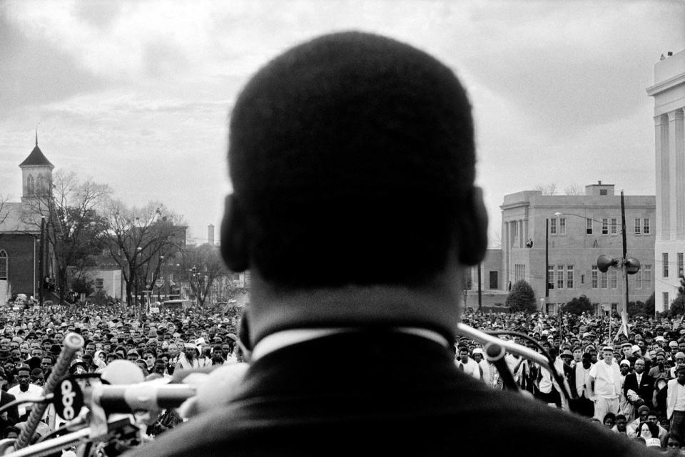 Dr. Martin Luther King Jr. Looks out at crowd in Montgomery, 1965. 