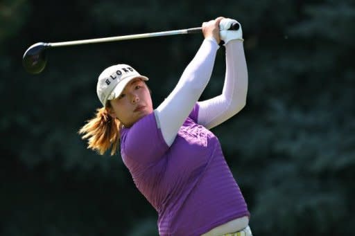 Feng Shanshan of China hits her tee shot on the sixth hole during the final round of the Wegmans LPGA Championship at Locust Hill Country Club in Pittsford, New York. Feng became the first Chinese golfer to win a major title by firing a bogey-free five-under par 67 on Sunday to capture the LPGA Championship