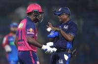 Rajasthan Royals' captain Sanju Samson talks to umpire after getting out during the Indian Premier League cricket match between Delhi Capitals and Rajasthan Royals in New Delhi, India, Tuesday, May 7, 2024. (AP Photo/Manish Swarup)