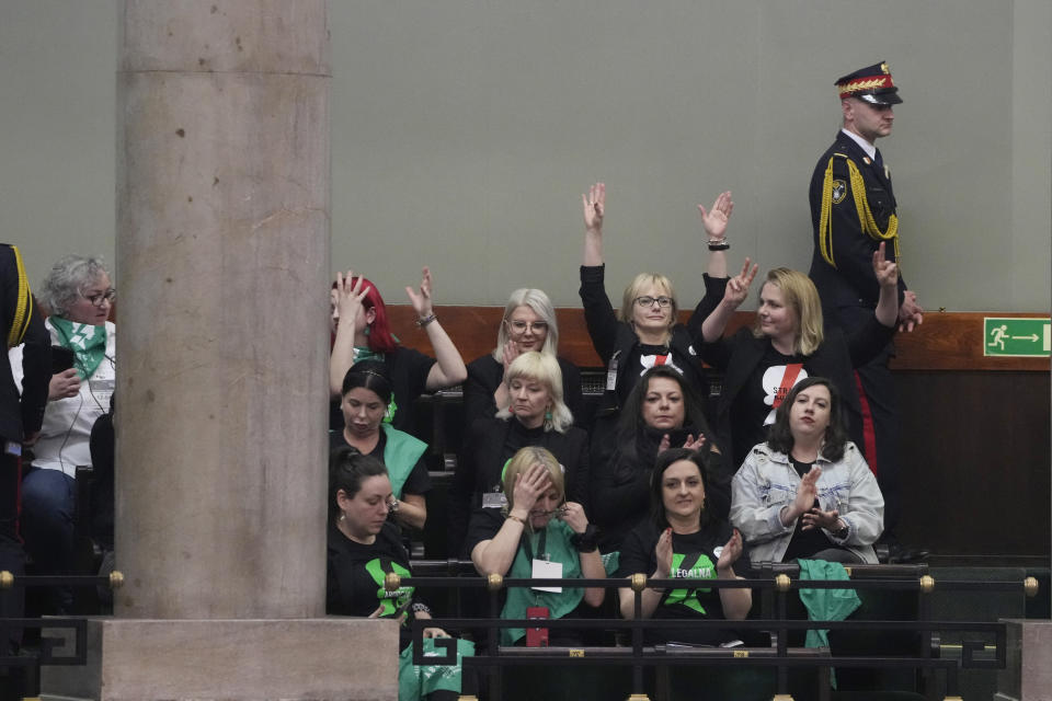 Abortion rights activists react after Poland's parliament voted to continue work on proposals to liberalize Poland's strict abortion law, in Warsaw, Poland, on Friday, April 12, 2024. Polish lawmakers voted Friday to continue work on proposals to lift a near total ban on abortion, a divisive issue in the traditionally Roman Catholic country, which has one of the most restrictive laws in Europe. (AP Photo/Czarek Sokolowski)