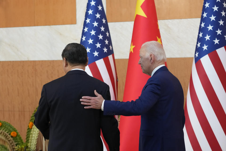 U.S. President Joe Biden, right, walks with Chinese President Xi Jinping before their meeting on the sidelines of the G20 summit meeting, Monday, Nov. 14, 2022, in Nusa Dua, in Bali, Indonesia. (AP Photo/Alex Brandon)