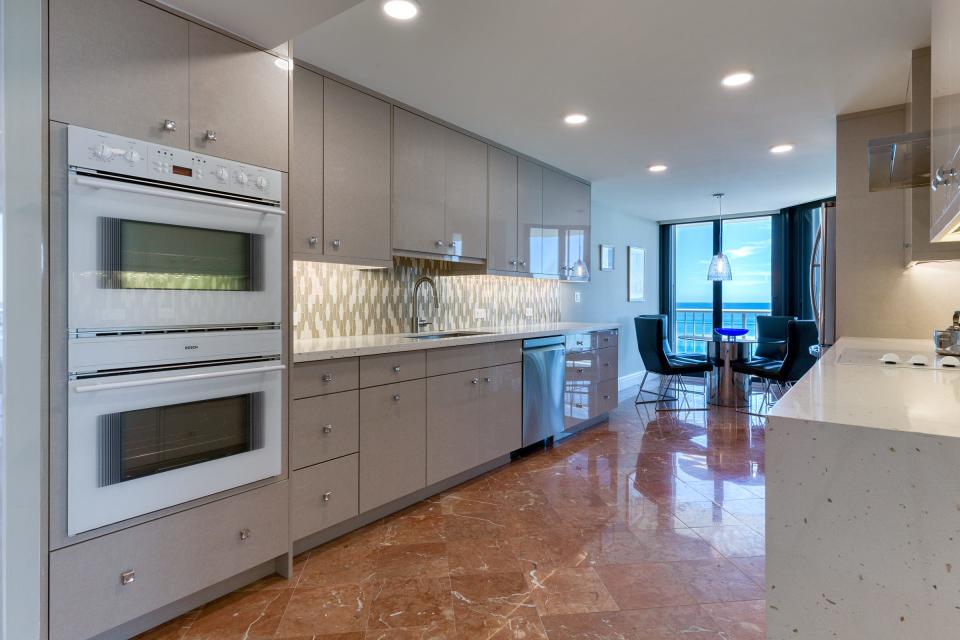 With its tiled backsplash, the galley-style kitchen was expanded during the 2019 renovation