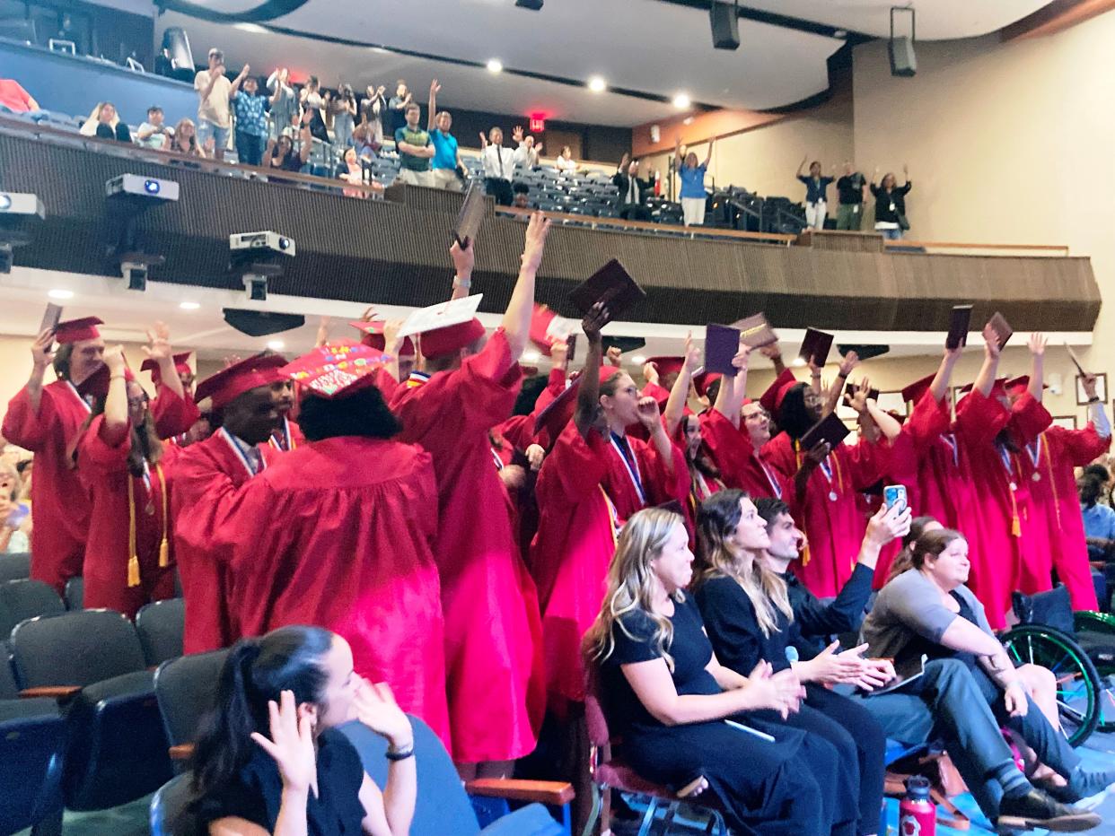 Graduates of the Florida School for the Deaf and the Blind's Deaf High School celebrate during the commencement ceremony on Friday.