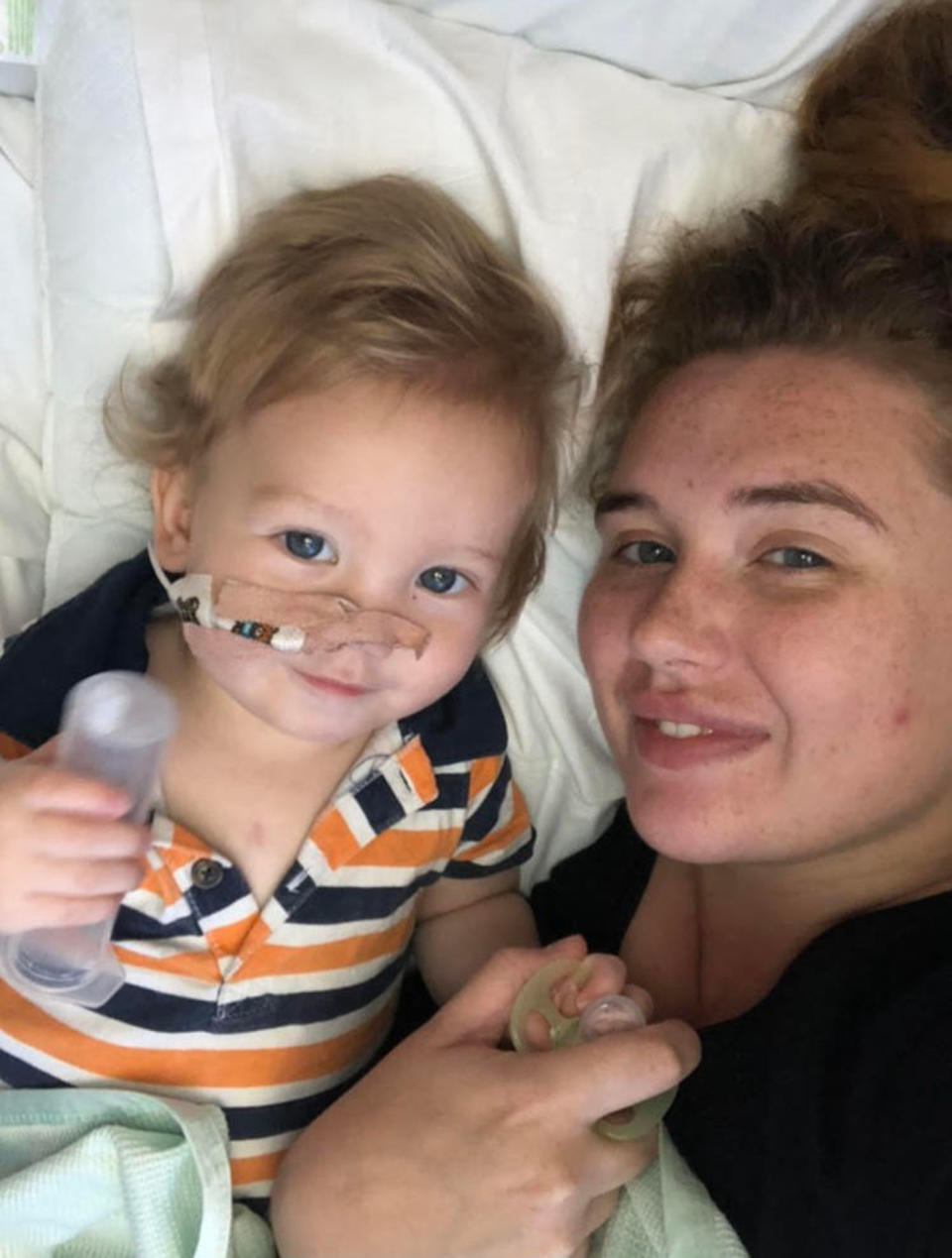 Hollie Phillips pictured with son Ralphie in hospital after he swallowed a button battery. She has shared a TikTok warning.