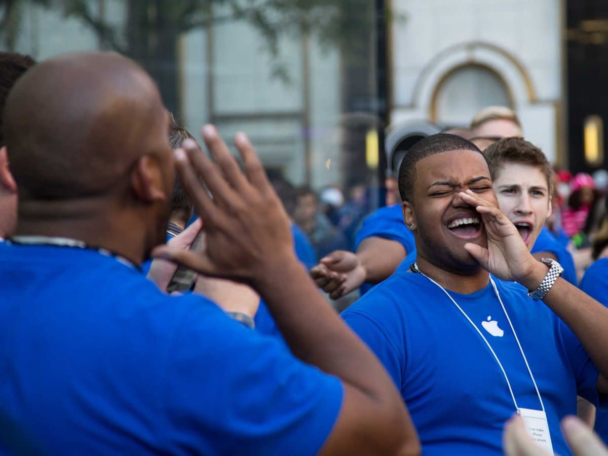 apple store employees cheer as people enter the cube in nyc