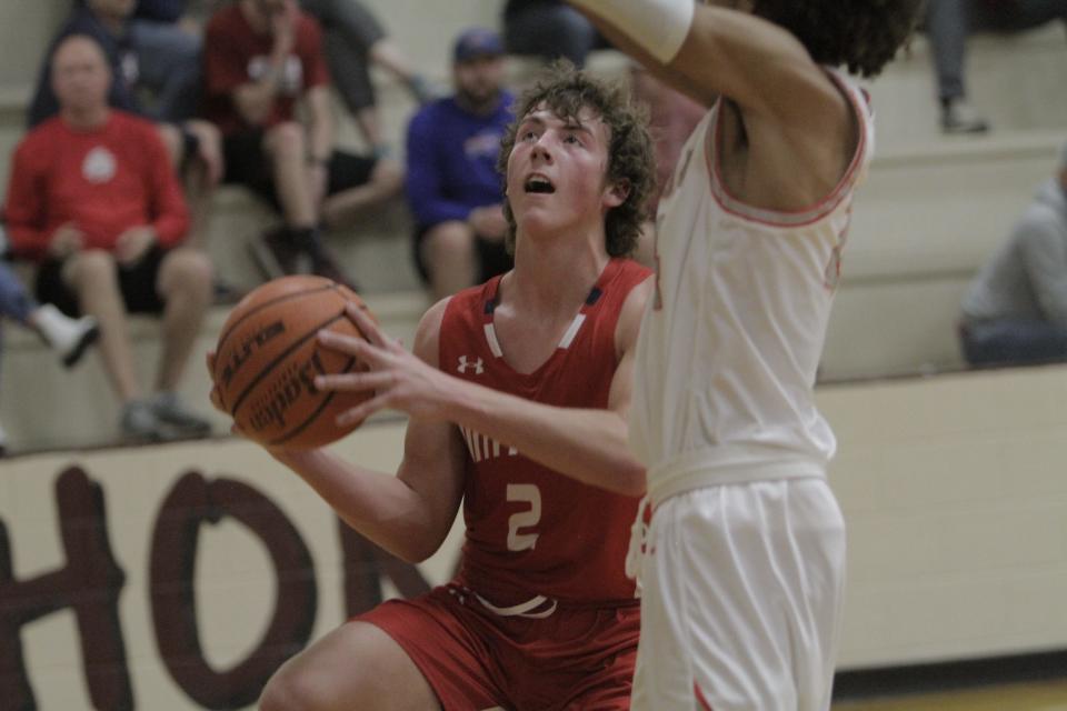 Jim Ned sophomore Carter Wood attempts a layup against a Holliday defender on Monday, Dec. 27.