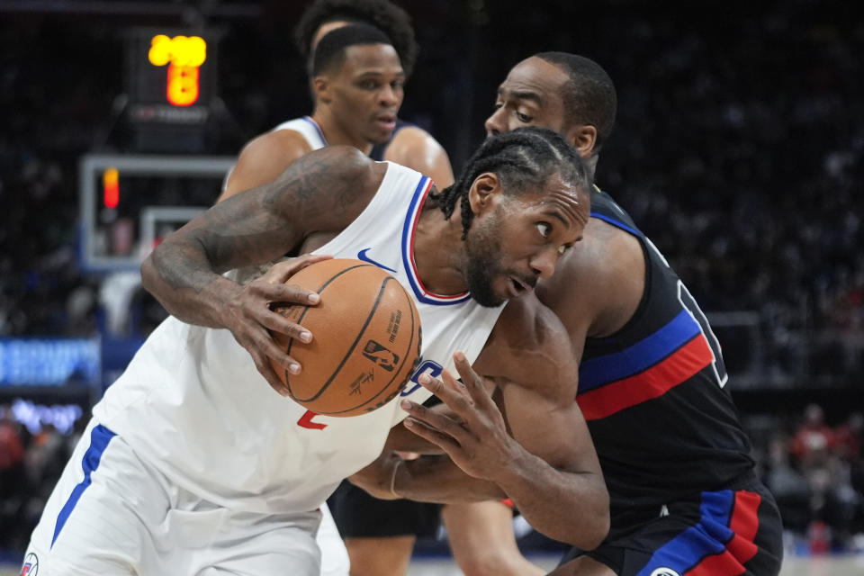 Los Angeles Clippers forward Kawhi Leonard (2) drives on Detroit Pistons guard Alec Burks (14) in the second half of an NBA basketball game in Detroit, Friday, Feb. 2, 2024. (AP Photo/Paul Sancya)