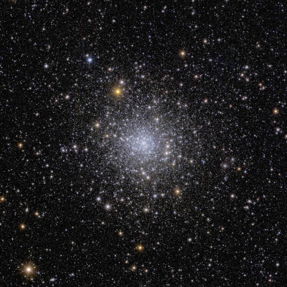 A view of many stars and galaxies, all white and yellow light with starry streaks coming off them