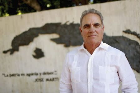 Joe Arriola, 67, a Cuban-born former manager of the city of Miami, poses for a photo near the Bay of Pigs in Miami, Florida, May 17, 2014. REUTERS/Brian Blanco