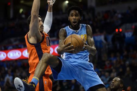 Dec 27, 2015; Oklahoma City, OK, USA; Denver Nuggets forward Will Barton (5) shoots the ball in front of Oklahoma City Thunder center Enes Kanter (11) during the second quarter at Chesapeake Energy Arena. Mandatory Credit: Mark D. Smith-USA TODAY Sports