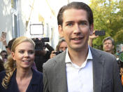 Former Austrian chancellor and top candidate of the Austrian People's Party, OEVP, Sebastian Kurz and his girlfriend Susanne Thier leave the polling station after they cast their vote in Vienna, Austria, Sunday, Sept. 29, 2019. (AP Photo/Matthias Schrader)