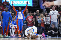 Oklahoma City Thunder forward Jalen Williams falls to the court after being injured in the first half of Game 3 of an NBA basketball first-round playoff series against the New Orleans Pelicans in New Orleans, Saturday, April 27, 2024. (AP Photo/Gerald Herbert)