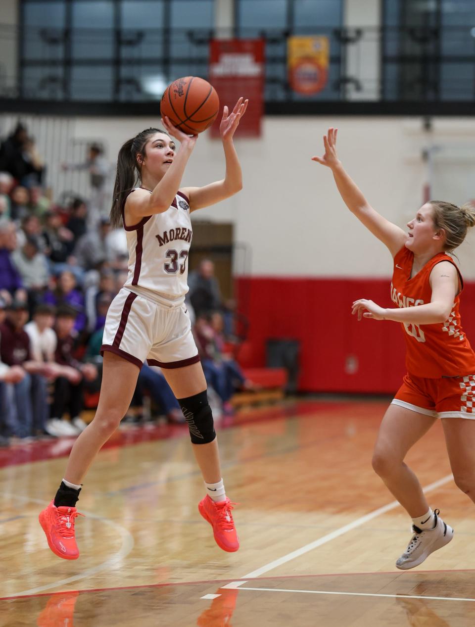 Morenci's Emersyn Bachelder goes up for a shot over Mayley Mannebach of Summerfield during a 40-16 Morenci win in the semifinals of the Division 4 Regional at Whitmore Lake on Monday, March 11, 2024.