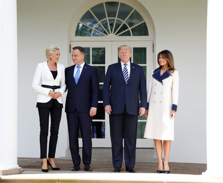 U.S. President Donald Trump and first lady Melania Trump stand with Poland's President Andrzej Duda and his wife, Agata Kornhauser-Duda, at the White House in Washington, U.S., September 18, 2018. REUTERS/Kevin Lamarque