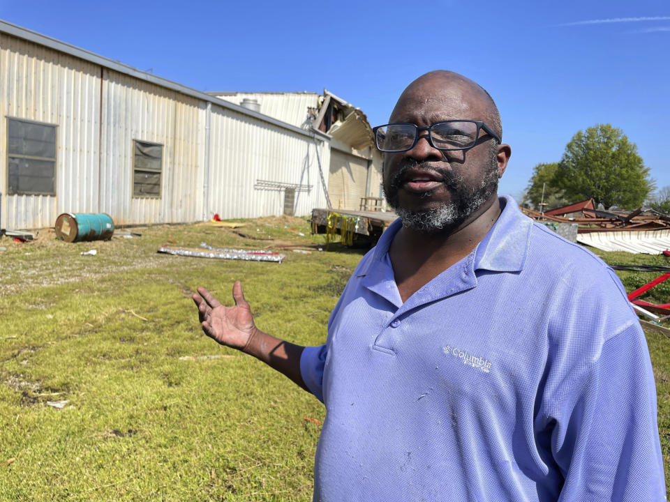 Wayne Williams stands outside the South Delta CT building in Rolling Fork, Miss., Sunday, March 26, 2023, where he teaches construction skills at the vocational center. Williams was working with others Sunday to clean up some relatively minor damage at the building, resulting from recent severe weather. (AP Photo/Emily Wagster Pettus)