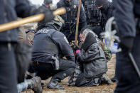 <p>National Guard and Police make arrests at the Octei Sakowin Encampment near Cannon Ball, N.D., Feb. 23, 2017. (Mcknight/Rex Shutterstock via ZUMA Press) </p>