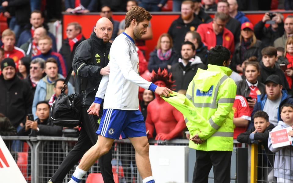 Marcos Alonso of Chelsea leaves the pitch following the warm up prior to the Premier League match between Manchester United and Chelsea - Credit: GETTY