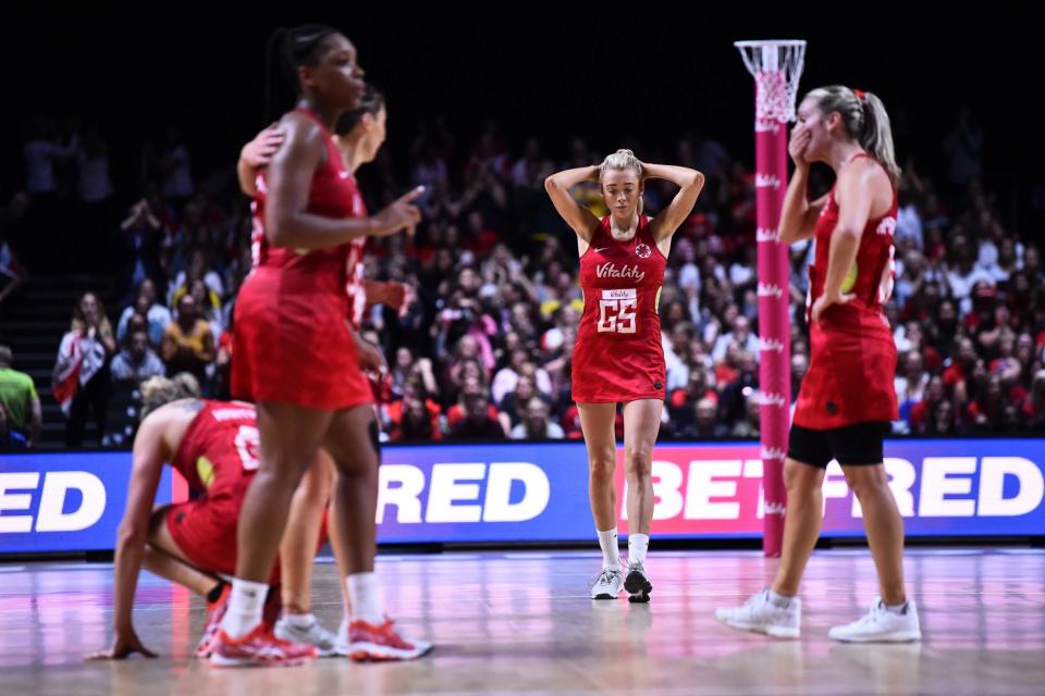 England's netball stars suffered World Cup heartbreak as they fell at the penultimate hurdle in their bid for global glory home soil. New Zealand goal shooter Maria Fola and team-mate Ameliaranne Ekenasio were on clinical form as they squeezed past the hosts to set up a mouth-watering final with rivals Australia. England suffered an early scare in their semi-final as Folau gave New Zealand a 5-0 lead inside the first four minutes.Folau, who had been booed during the pre-game introductions after recently defending her husband Israel's controversial religious beliefs, scored four from four to get the Silver Ferns off to a flying start.After showing some nerves in front of goal, England recovered to haul back the deficit but still faced a big task as they trailed 12-9 at the end of the first.Nerves continued to be in evident for England who slipped six points behind midway through the second quarter, prompting coach Tracey Neville to make changes.Neville switched the respective roles of Housby and the misfiring Harten, and introduced Natalie Haythornthwaite in place of Chelsea Pitman.The move made a dramatic difference as Housby hauled England level before Harten belatedly rediscovered her form to shoot her team 24-21 in front with a quick-fire triple before the break.Nerves continued to be in evident for England who slipped six points behind midway through the second quarter, prompting coach Tracey Neville to make changes.Neville switched the respective roles of Housby and the misfiring Harten, and introduced Natalie Haythornthwaite in place of Chelsea Pitman.The move made a dramatic difference as Housby hauled England level before Harten belatedly rediscovered her form to shoot her team 24-21 in front with a quick-fire triple before the break.England fell further behind before a crucial interception from Harten helped haul the deficit back to two as the game moved deeper into the final quarter.But the superbly-poised Ekenasio was showing no signs of the raucous home crowd getting to her as she continued her flawless scoring record to put New Zealand five points clear with seven minutes to go.Despite again reeling in their opponents to a two-point gap heading into the final minute, New Zealand hung on for a 47-45 win which means England's long wait for a place in a World Cup final goes on.
