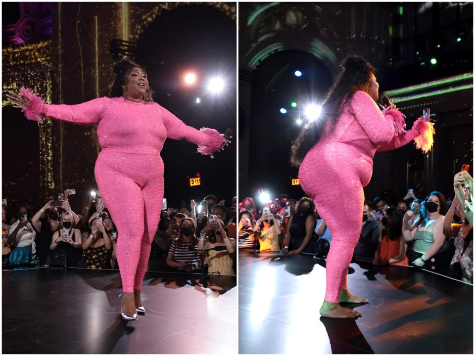 Lizzo performing in heels and barefoot on stage